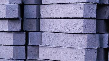 Pile of paving block, grey abstract textured background, copy space photo