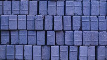 Pile of paving block, grey abstract textured background, copy space photo