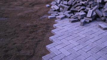Pile of paving block, grey abstract textured background, copy space photo