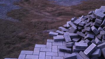 Pile of paving block, grey abstract textured background, copy space photo