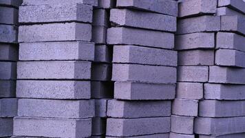 Pile of paving block, grey abstract textured background, copy space photo