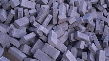 Pile of paving block, grey abstract textured background, copy space photo
