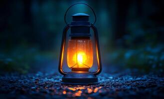 A lantern is lit in the dark, casting a warm glow on the ground. The scene is peaceful and calming, with the light providing a sense of comfort and security photo