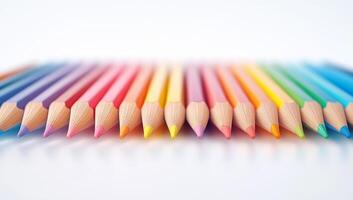 A vibrant array of colored pencils displays a spectrum of hues, neatly aligned for art and creativity, perfect for artists of all ages. photo
