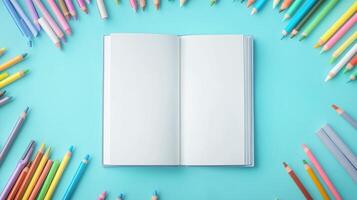 Blank white book and pencils coloring decoration for drawing or texting and pastel background photo