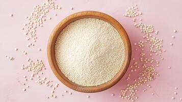 Quinoa flour on brown wooden bowl and some Quinoa seeds for baking, gluten free copy space photo