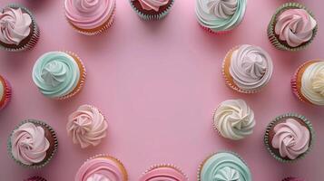 Circular arrangement sweet cupcake topping cream copy space black in center pink background photo