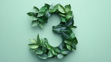 The number 3 is framed by a series of green leaves solid background photo