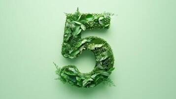 The number 5 is framed by a series of green leaves solid background photo