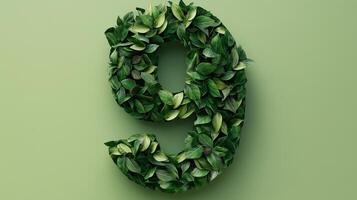 The number 9 is framed by a series of green leaves solid background photo