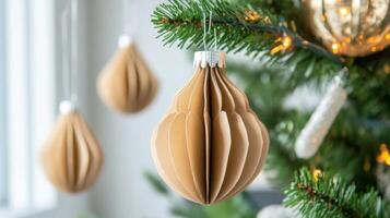 A Brown Paper Christmas Ornament Hanging on a Tree photo