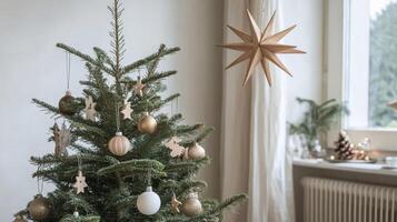 Decorated Christmas Tree with Wooden Ornaments and a Star photo