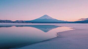 Mount Fuji Reflected in a Frozen Lake at Sunset photo