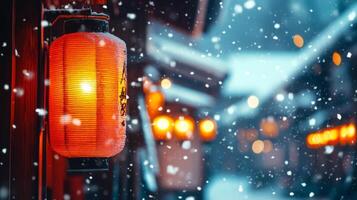 A Single Red Lantern in the Snowy Japanese Cityscape photo