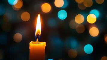 A Single Candle Flame Illuminated Against a Blurred Background of Warm and Cool Lights photo