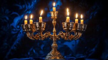 Ornate Golden Candelabra with Lit Candles on a Blue Background photo