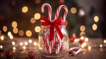 Christmas Candy Canes in a Jar with a Red Bow photo