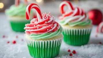Festive Christmas Cupcakes with Candy Cane Topping and Green Frosting photo