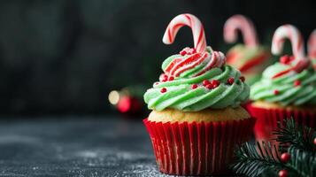 Festive Green and Red Christmas Cupcakes with Candy Cane Toppings photo