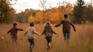Family Running Through Autumnal Field photo