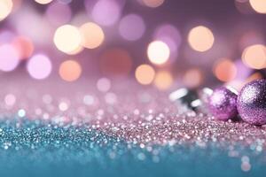 Sparkling purple Christmas baubles on a glittery surface with bokeh lights in the background photo