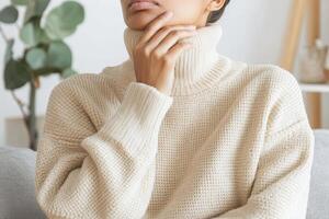 Woman wearing a beige turtleneck sweater photo