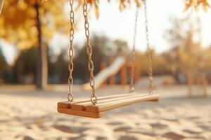 Empty swing hangs at a playground photo