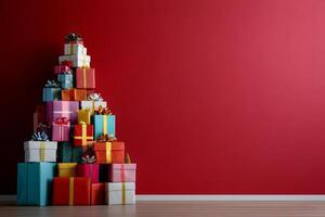 Stack of Christmas presents wrapped in patterned paper on red background photo