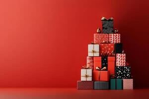 Stack of Christmas presents wrapped in patterned paper on red background photo