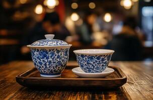 Two cups and saucer on a wooden tray photo