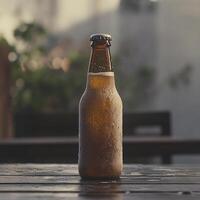 A brown bottle of beer sitting on a table photo