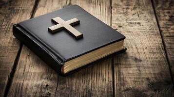 A wooden background featuring a cross resting on an open book, symbolizing faith and reflection photo
