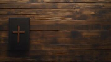 A wooden background featuring a cross resting on a book, background with space photo