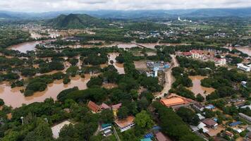 Aerial view of the suburb of Chiang Rai province flooding by Kok river after typhoon Yagi has swept Southeast Asia. photo