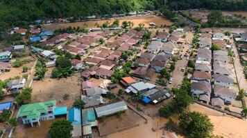 Aerial view of housing estate in suburb of Chiang Rai flooded by Kok river after typhoon Yagi has swept Southeast Asia. photo