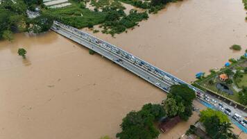 Aerial view of car stuck on the bridge after road flooded during typhoon Yagi has swept Southeast Asia. photo