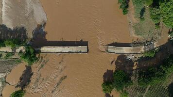 Aerial view of small bridge in Mae Yao district of Chiang Rai province collapsed after typhoon Yagi swept across Thailand. photo