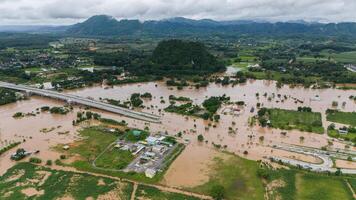 Aerial view of the suburb of Chiang Rai province flooding by Kok river after typhoon Yagi has swept Southeast Asia. photo