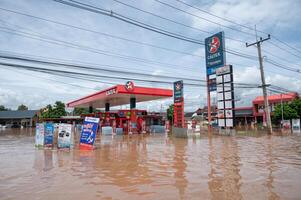 Chiang Rai, Thailand - 12-September-2024 - The Caltex fuel gas station flooding by Kok river after typhoon Yagi has swept Southeast Asia. photo