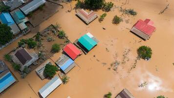Aerial view of small village in suburb of Chiang Rai flooding by Kok river after typhoon Yagi has swept Southeast Asia. photo