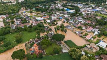 Aerial view of suburb area in Chiang Rai downtown flooding by Kok river after typhoon Yagi has swept Southeast Asia. photo