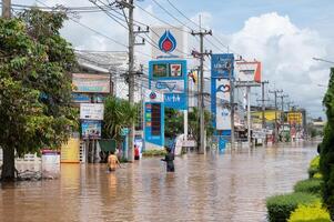 Chiang Rai, Thailand - 12-September-2024 - Scenery view of the highway road in Chiang Rai downtown flooding by Kok river after typhoon Yagi has swept Southeast Asia. photo