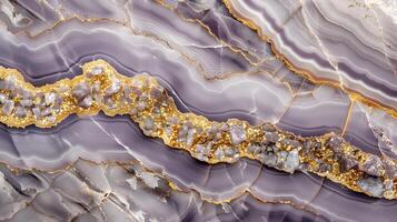 Elegant marble texture background featuring smooth, flowing patterns and shimmering golden accents photo