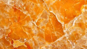 A vibrant orange marble texture showcasing natural patterns and intricate veining details photo