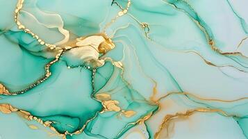 Marble ink background with turquoise and gold swirling patterns on a serene canvas photo