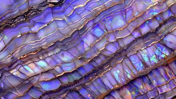 A vibrant opal texture background displaying mesmerizing purple and gold waves and patterns photo