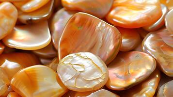 Various iridescent pearls lay against a soft background, showcasing their unique textures and colors photo
