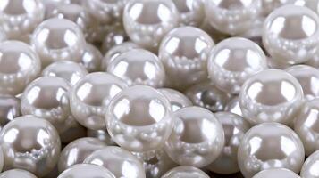 Natural pearls clustered together on a soft background for a timeless, elegant display photo
