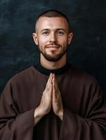 A priest prays with hands together, reflecting peace and devotion in a serene atmosphere photo