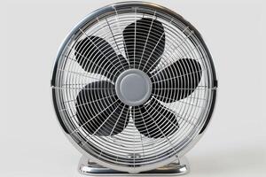 Chrome desk fan blowing air in the heat photo